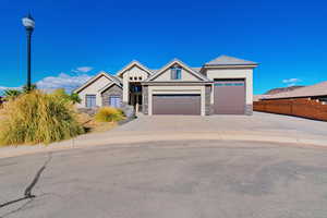 View of front facade featuring a garage