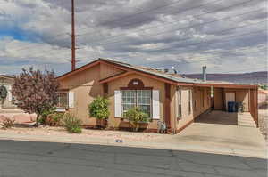 View of front of home with a carport