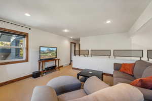 Living room featuring light carpet