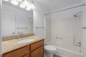 Full bathroom with vanity, toilet, and bathing tub / shower combination