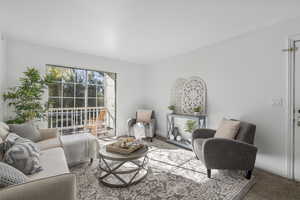 Living room featuring carpet floors