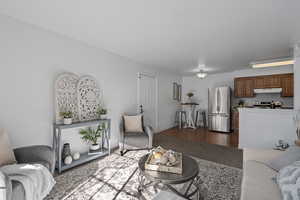 Living room featuring dark wood-type flooring