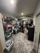 Walk in closet with carpet