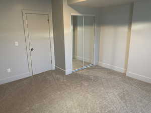 Unfurnished bedroom featuring carpet floors