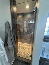 Primary Bathroom featuring walk in shower