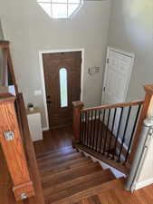 Foyer featuring a healthy amount of sunlight and hardwood flooring