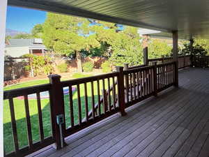 Covered Deck featuring a lawn