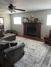 Family room featuring hard wood floors and wood fireplace