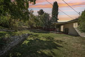 Yard at dusk with a patio