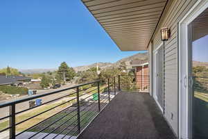 Balcony with mountain and city views from 2 bedrooms on main