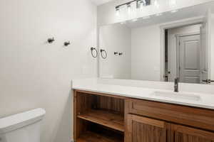 Half bath with toilet and vanity