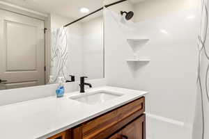 Full bathroom with vanity and shower / tub combo