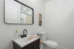 Bathroom with vanity and toilet