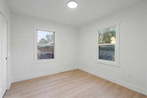 Spare room with light hardwood / wood-style floors