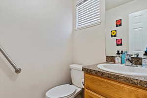 Bathroom with vanity and toilet