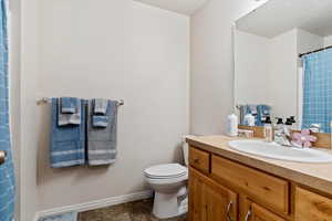 Bathroom with vanity and toilet