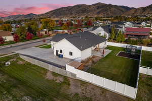 Aerial view at dusk featuring a mountain view