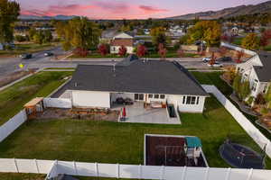 Aerial view at dusk featuring a mountain view