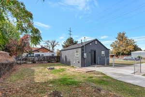 Exterior space with a yard and an outdoor fire pit