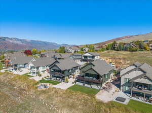 Birds eye view of property with a mountain view