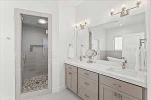 Bathroom featuring vanity and plus walk in shower