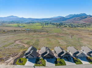 Birds eye view of property with a mountain view and a rural view