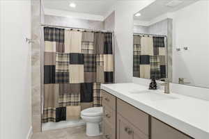 Bathroom with vanity, toilet, a shower with shower curtain, and tile patterned flooring