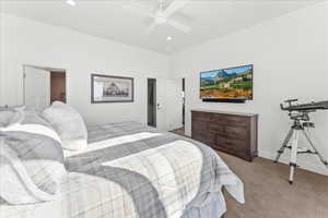 Bedroom with ceiling fan and carpet floors