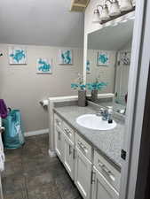 Bathroom with vanity and tile patterned floors