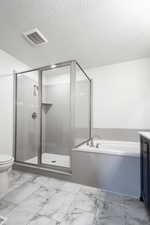 Full bathroom with vanity, separate shower and tub, a textured ceiling, and toilet