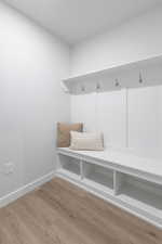 Mudroom with hardwood / wood-style flooring