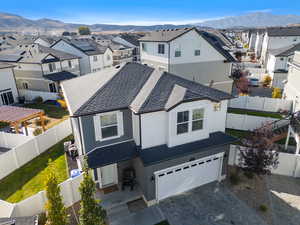 View of front of home featuring a garage and a mountain view