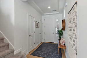 Entrance foyer featuring hardwood / wood-style flooring