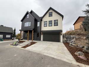 Modern inspired farmhouse featuring a garage