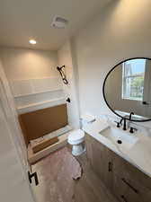 Bathroom featuring vanity and toilet