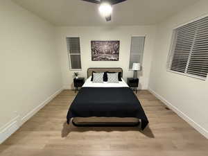 Bedroom featuring ceiling fan and light hardwood / wood-style floors