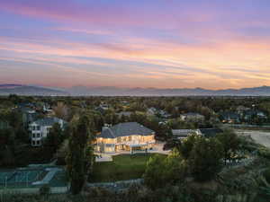 Aerial view at dusk featuring a mountain view