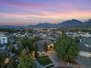 Aerial view at dusk featuring a mountain view