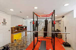 Exercise room featuring a textured ceiling