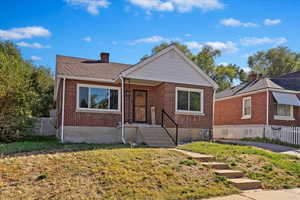 View of front of property with a front yard