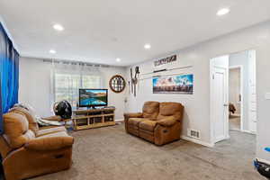 Living room featuring carpet floors