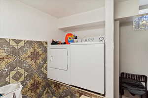 Laundry room with separate washer and dryer