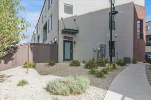 View of building exterior with cooling unit