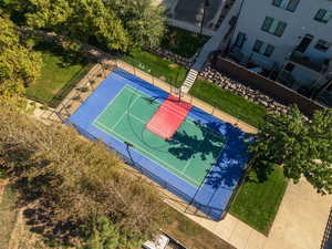 View of basketball court with a lawn and tennis court