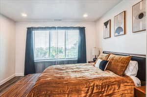 Bedroom featuring dark wood-type flooring