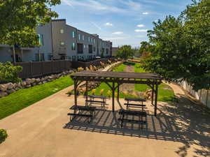 View of home's community with a patio area and a lawn