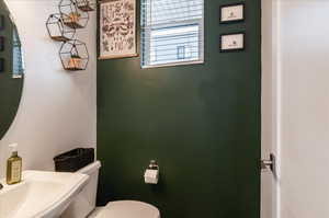 Bathroom featuring toilet and sink