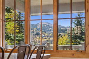 Sunroom / solarium with a mountain view