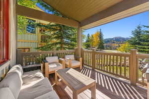 Wooden terrace featuring a mountain view