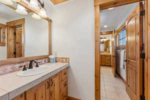 Bathroom featuring vanity and tile patterned flooring